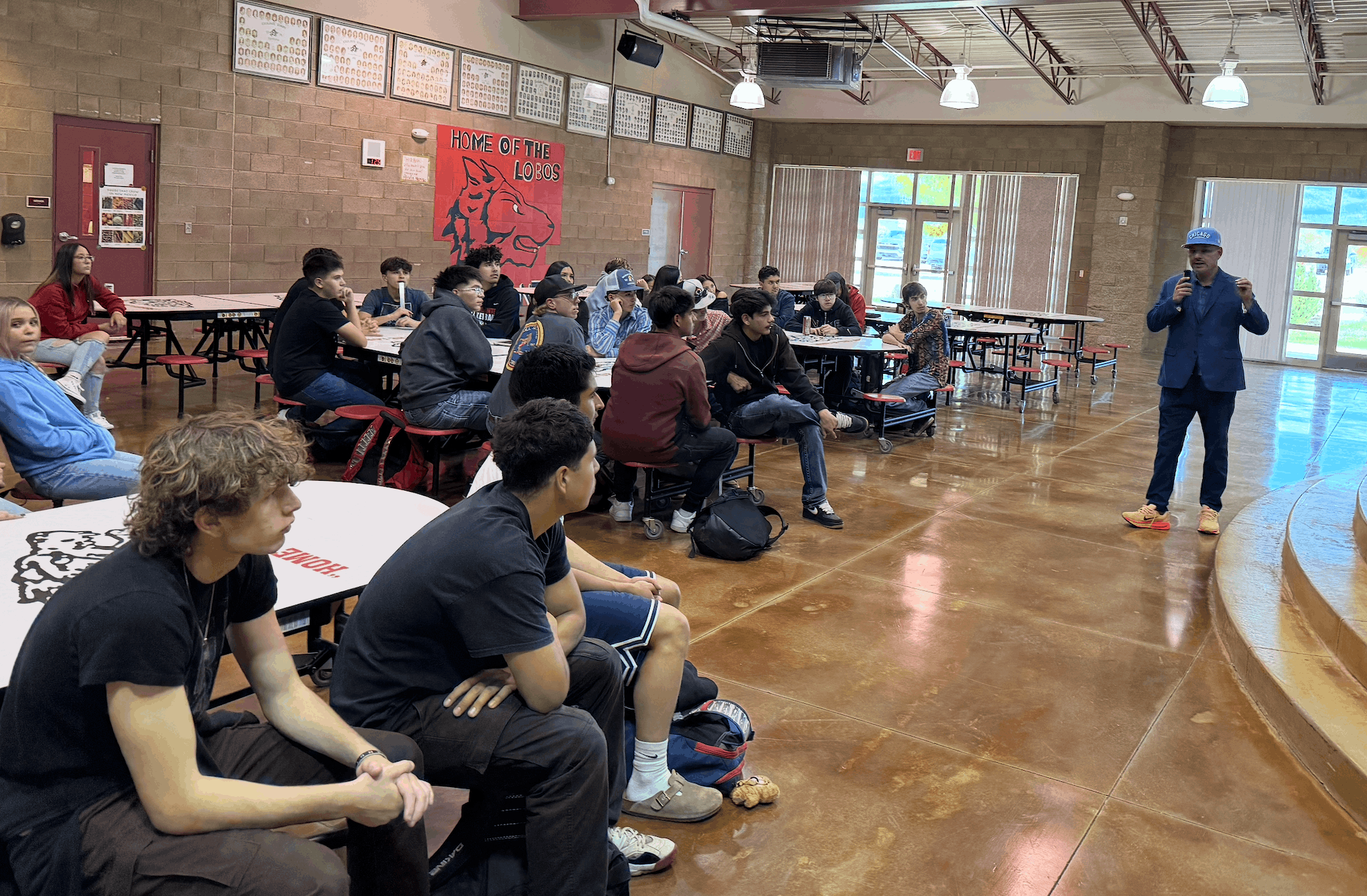 Javier Vigil of the Northern NM ROC Foundation speaks to Escalante juniors and seniors in the cafeteria on October 7